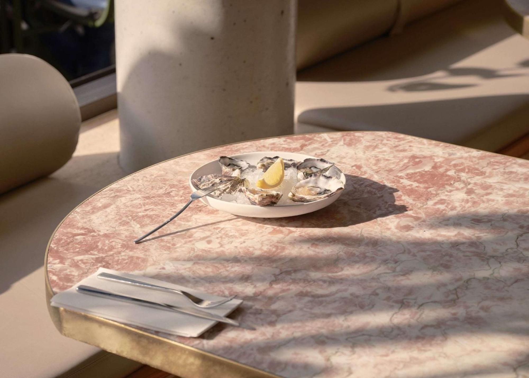 The Calile Hotel Brisbane Exterior photo Oysters on a table